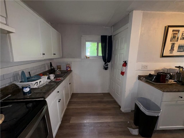 895 S Plymouth Ave, Rochester, NY 14608 - kitchen with electric range, dark wood-style flooring, white cabinetry, wainscoting, and dark countertops