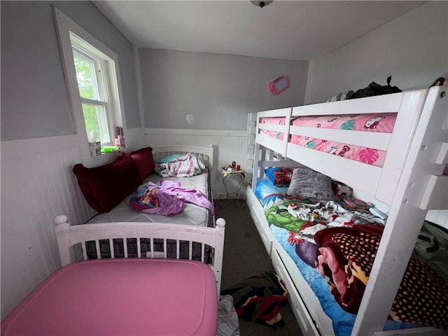 895 S Plymouth Ave, Rochester, NY 14608 - carpeted bedroom featuring a wainscoted wall