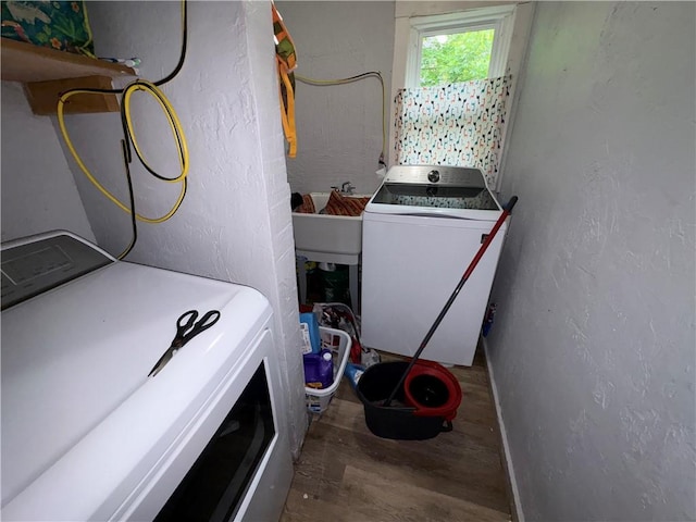 895 S Plymouth Ave, Rochester, NY 14608 - washroom with wood finished floors, a textured wall, and independent washer and dryer