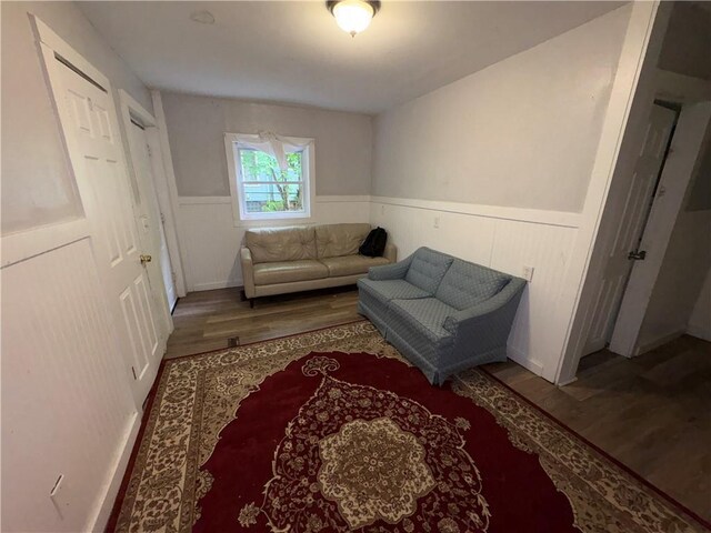895 S Plymouth Ave, Rochester, NY 14608 - sitting room featuring wood finished floors and a wainscoted wall
