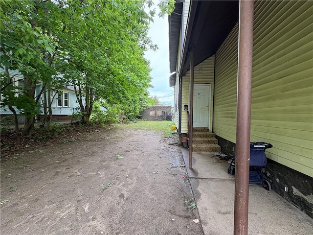 895 S Plymouth Ave, Rochester, NY 14608 - view of property exterior with entry steps and asphalt driveway