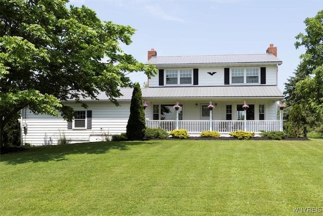 3212 Hickox Rd, Hamburg, NY 14075 - view of front facade with covered porch, a chimney, and a front lawn