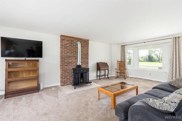 3212 Hickox Rd, Hamburg, NY 14075 - carpeted living room with a wood stove and baseboards