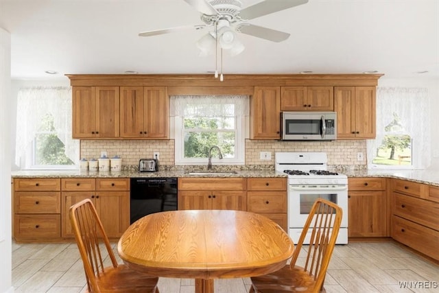 3212 Hickox Rd, Hamburg, NY 14075 - kitchen with stainless steel microwave, white range with gas stovetop, dishwasher, and decorative backsplash