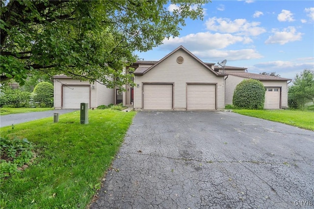 8433 Bubbling Springs Dr, Clay, NY 13027 - view of front of home featuring a front yard, driveway, and an attached garage