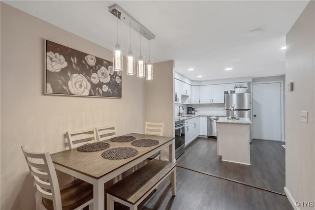 8433 Bubbling Springs Dr, Clay, NY 13027 - dining space featuring dark wood-style floors and recessed lighting
