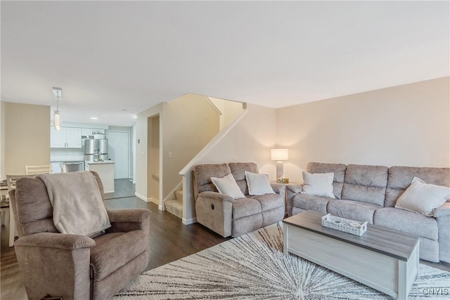 8433 Bubbling Springs Dr, Clay, NY 13027 - living area with stairway and dark wood-style flooring