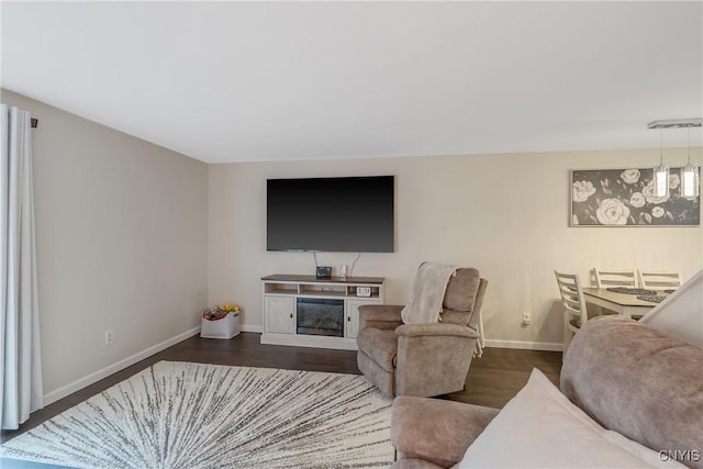 8433 Bubbling Springs Dr, Clay, NY 13027 - living area featuring dark wood-style flooring and a fireplace
