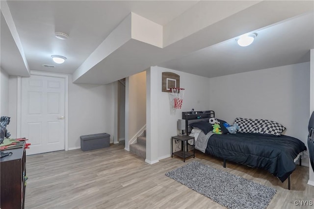 8433 Bubbling Springs Dr, Clay, NY 13027 - bedroom featuring light wood-style floors and baseboards