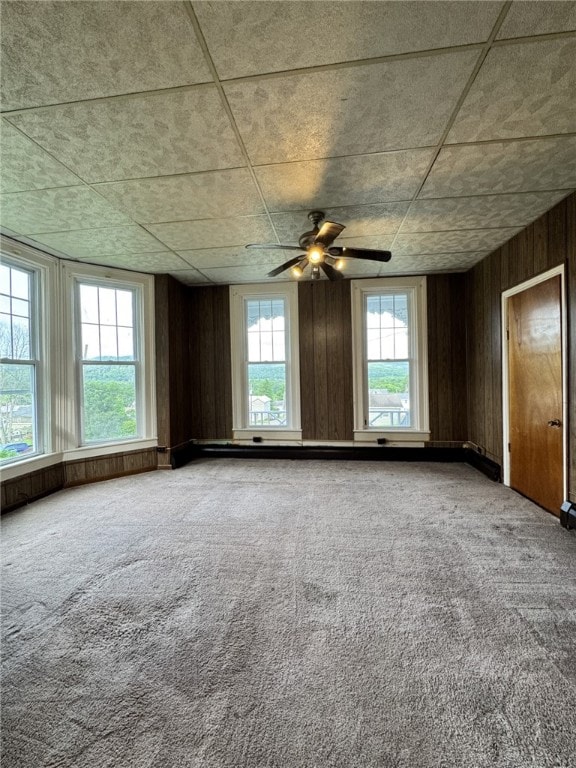 2 2nd St, Eldred, PA 16731 - empty room with carpet, a ceiling fan, and wooden walls