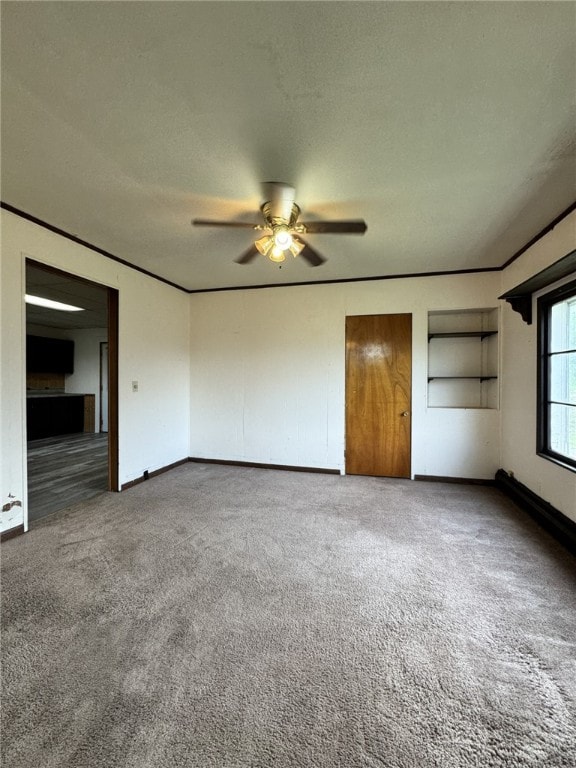 2 2nd St, Eldred, PA 16731 - unfurnished bedroom with carpet flooring, ornamental molding, and ceiling fan