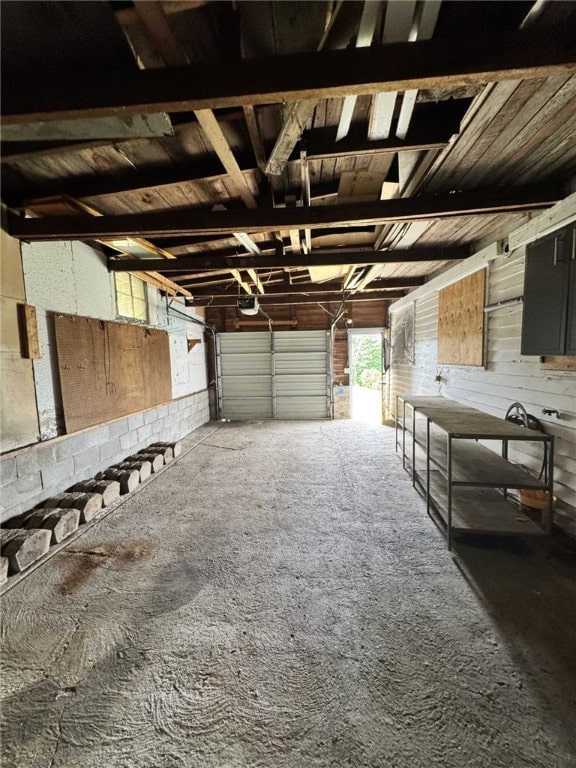 2 2nd St, Eldred, PA 16731 - garage with a garage door opener and wood walls