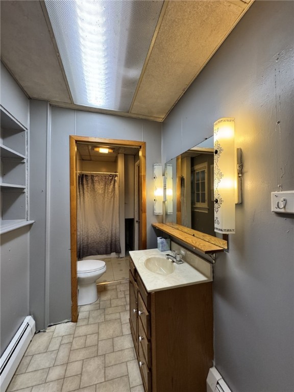 2 2nd St, Eldred, PA 16731 - full bathroom featuring a baseboard radiator, vanity, and curtained shower