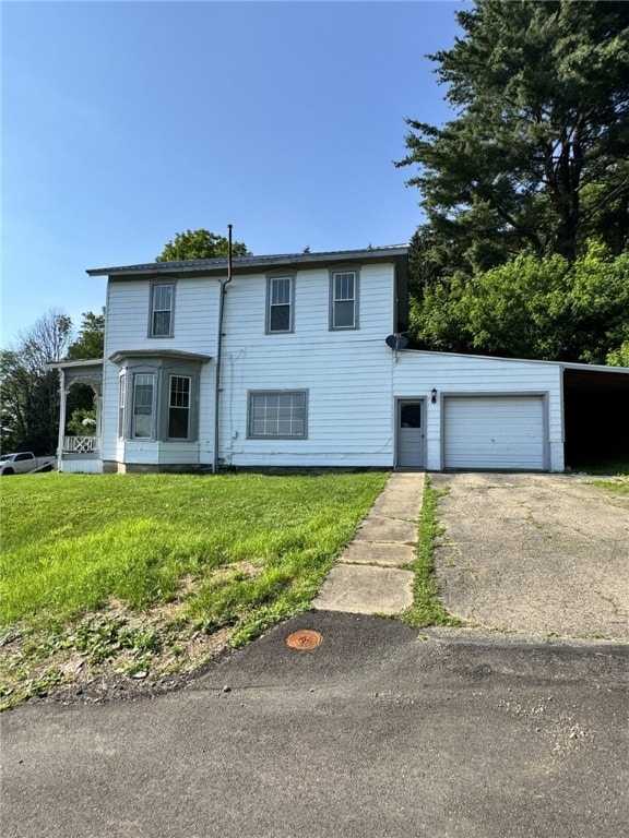 2 2nd St, Eldred, PA 16731 - traditional-style house with a garage, asphalt driveway, and a front yard