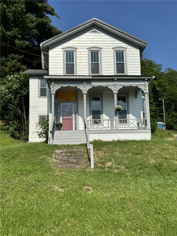 2 2nd St, Eldred, PA 16731 - view of front facade featuring covered porch and a front yard