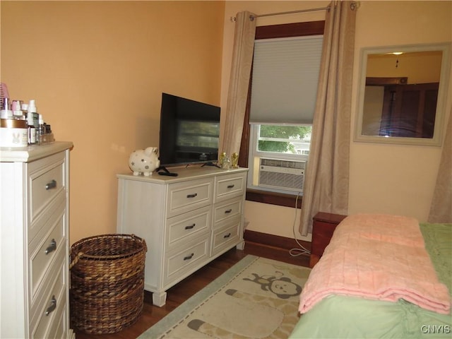 325 Margaret St, Herkimer, NY 13350 - bedroom with cooling unit and dark wood-style flooring