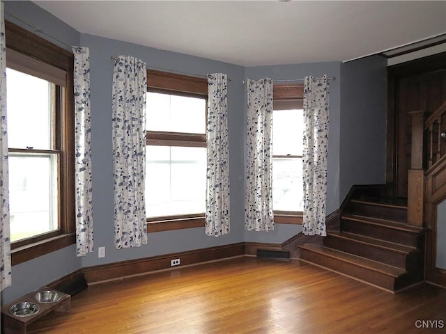 325 Margaret St, Herkimer, NY 13350 - unfurnished room with wood finished floors and stairs