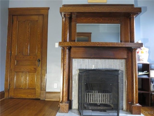325 Margaret St, Herkimer, NY 13350 - detailed view of a tiled fireplace and wood finished floors