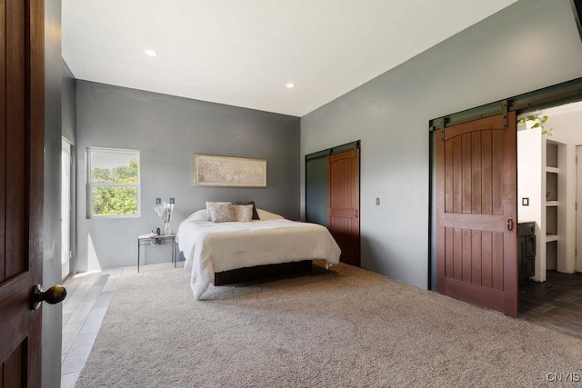 3785 Ransom Rd, Pompey, NY 13078 - bedroom with a barn door, recessed lighting, carpet floors, and tile patterned floors
