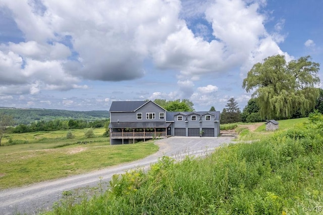 3785 Ransom Rd, Pompey, NY 13078 - rear view of house with driveway, an attached garage, and a yard