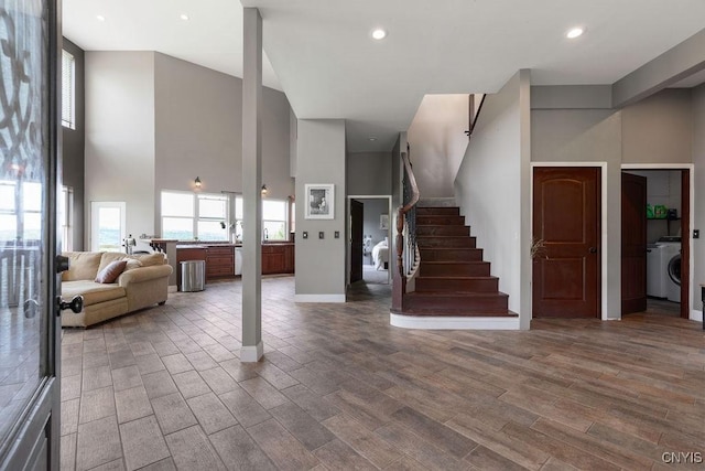 3785 Ransom Rd, Pompey, NY 13078 - entrance foyer featuring a towering ceiling, wood finished floors, stairs, washer / dryer, and recessed lighting