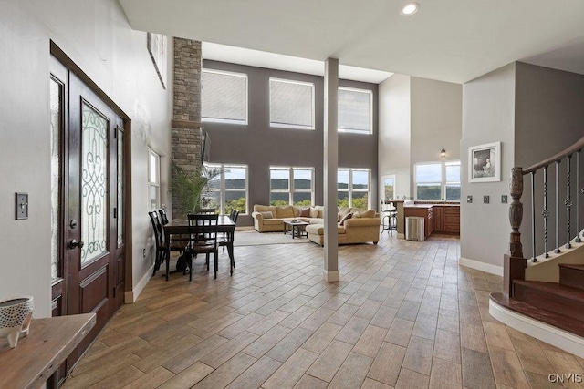 3785 Ransom Rd, Pompey, NY 13078 - entrance foyer with a towering ceiling, stairs, light wood-type flooring, and recessed lighting