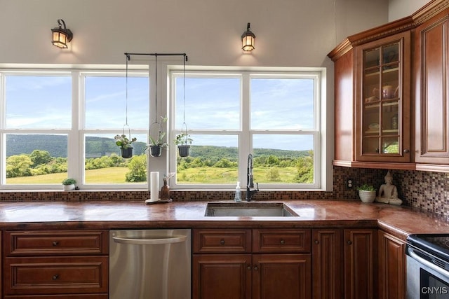 3785 Ransom Rd, Pompey, NY 13078 - kitchen with stainless steel dishwasher, dark countertops, glass insert cabinets, and backsplash