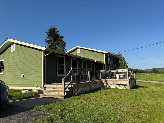 6303 Palmiter Rd, Alfred, NY 14803 - view of front of property featuring a front yard and a wooden deck
