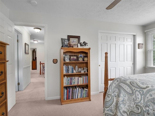 27 Black Spruce Ct, Greece, NY 14616 - carpeted bedroom with a textured ceiling, a closet, and a ceiling fan