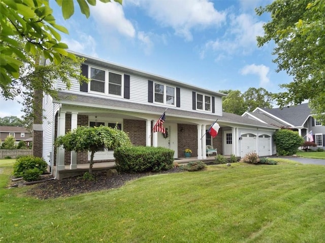 27 Black Spruce Ct, Greece, NY 14616 - traditional-style home featuring covered porch, a front yard, an attached garage, brick siding, and driveway