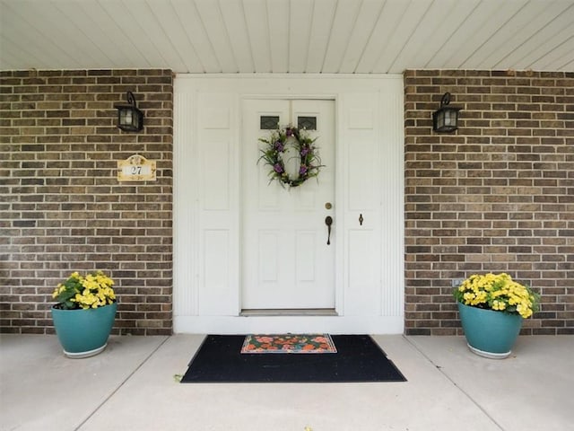27 Black Spruce Ct, Greece, NY 14616 - entrance to property with brick siding and covered porch