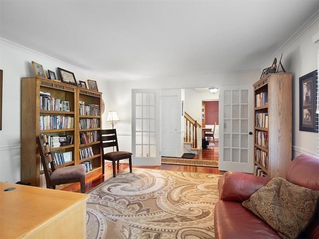 27 Black Spruce Ct, Greece, NY 14616 - living area with french doors, wood finished floors, ornamental molding, and stairs