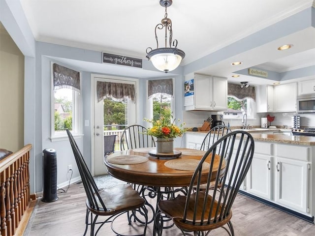 27 Black Spruce Ct, Greece, NY 14616 - dining room with crown molding, light wood-style floors, and recessed lighting