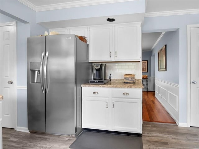 27 Black Spruce Ct, Greece, NY 14616 - kitchen featuring stainless steel fridge, crown molding, white cabinetry, wood finished floors, and backsplash