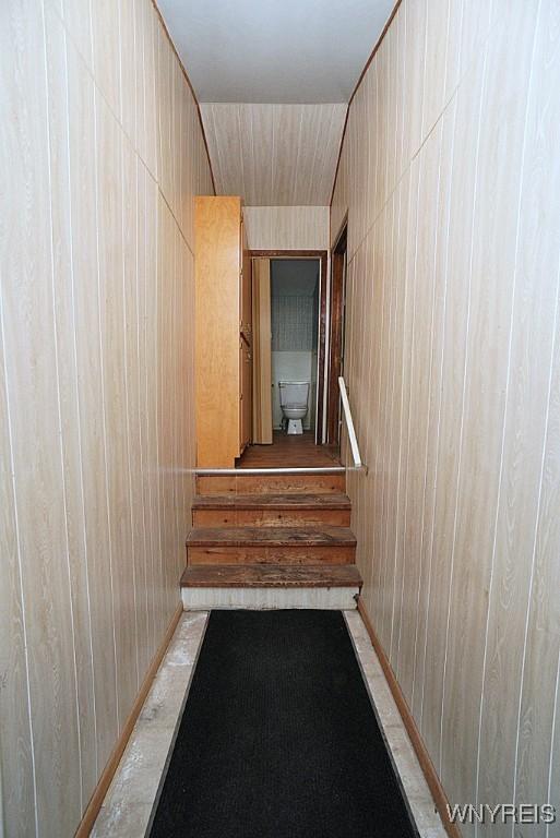 3840 Coomer Rd, Newfane, NY 14108 - stairway with wood walls