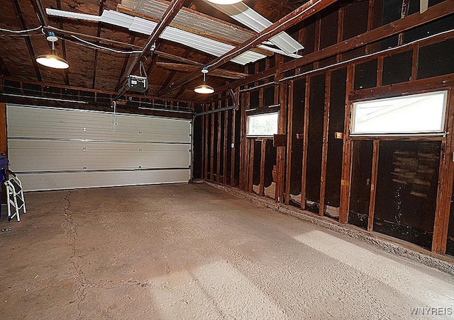 3840 Coomer Rd, Newfane, NY 14108 - garage featuring a garage door opener