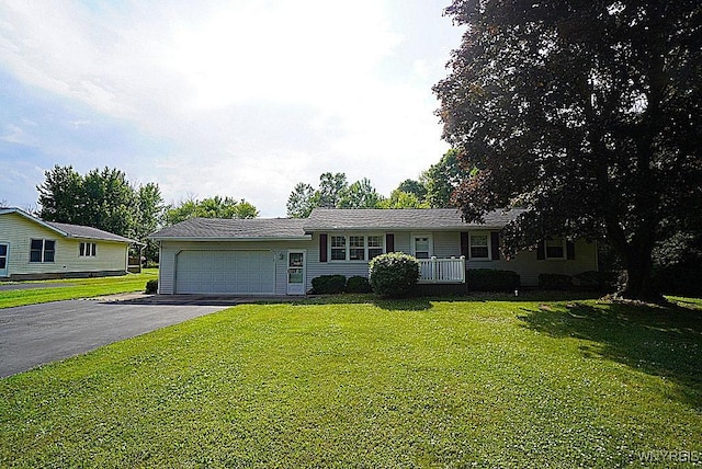 3840 Coomer Rd, Newfane, NY 14108 - ranch-style home featuring an attached garage, a front lawn, and driveway