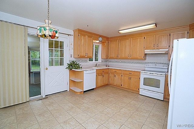 3840 Coomer Rd, Newfane, NY 14108 - kitchen with white appliances, under cabinet range hood, light countertops, decorative light fixtures, and decorative backsplash