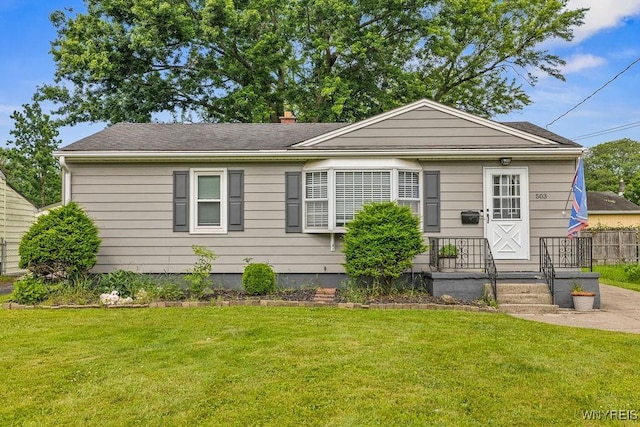 503 Kohl St, North Tonawanda, NY 14120 - view of front of house featuring a front yard and a chimney