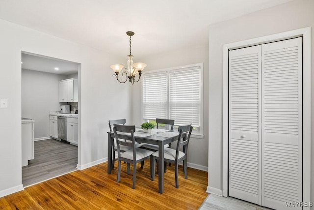 503 Kohl St, North Tonawanda, NY 14120 - dining area with a chandelier and light wood-style floors