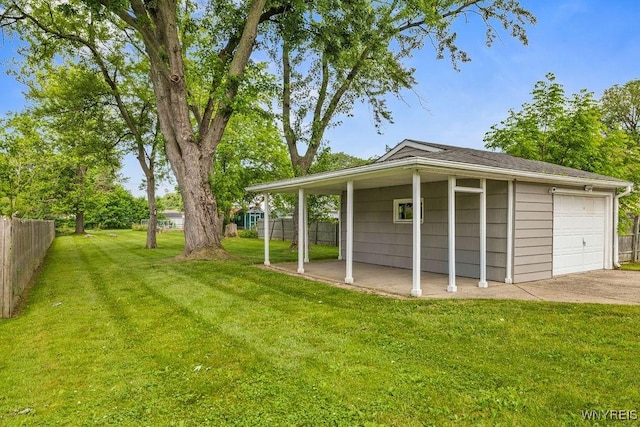 503 Kohl St, North Tonawanda, NY 14120 - view of yard featuring a garage and concrete driveway
