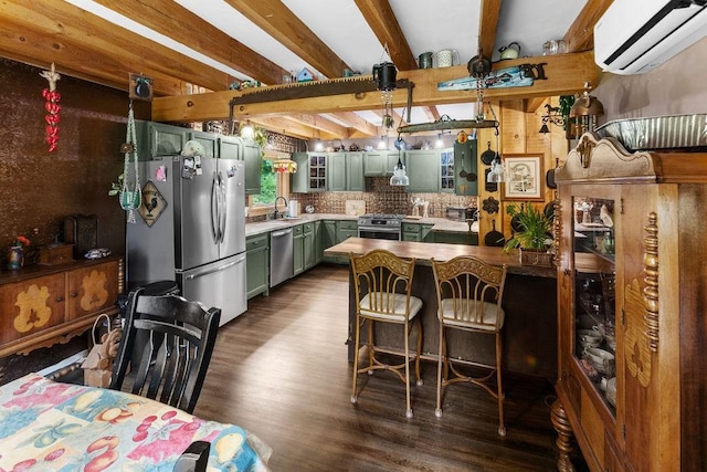 485 Spring Valley Rd, Delhi, NY 13753 - kitchen featuring green cabinetry, a wall unit AC, stainless steel appliances, dark wood-style flooring, and a peninsula