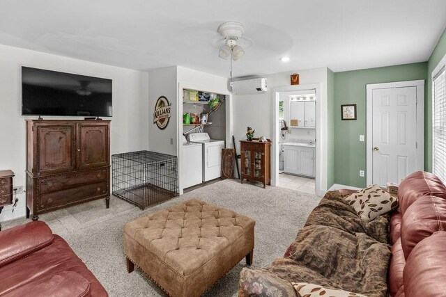 485 Spring Valley Rd, Delhi, NY 13753 - living area featuring a ceiling fan, an AC wall unit, washer and dryer, and light colored carpet