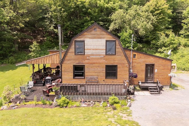 485 Spring Valley Rd, Delhi, NY 13753 - rear view of house featuring a wooden deck, a yard, and a gambrel roof