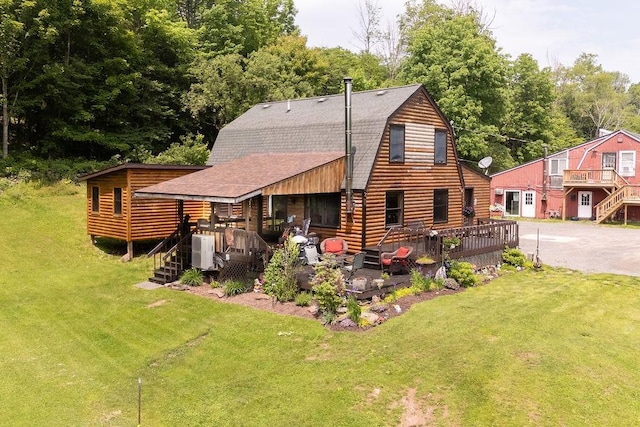 485 Spring Valley Rd, Delhi, NY 13753 - rear view of property with a gambrel roof, roof with shingles, a lawn, and a wooden deck