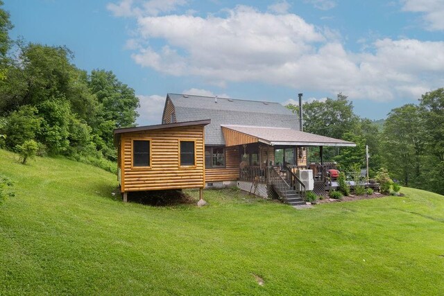 485 Spring Valley Rd, Delhi, NY 13753 - rear view of house featuring roof with shingles, a lawn, and crawl space