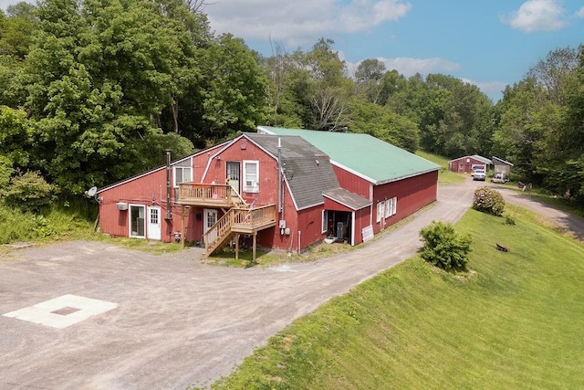 485 Spring Valley Rd, Delhi, NY 13753 - view of front of house featuring stairway, a wooden deck, dirt driveway, and a front yard