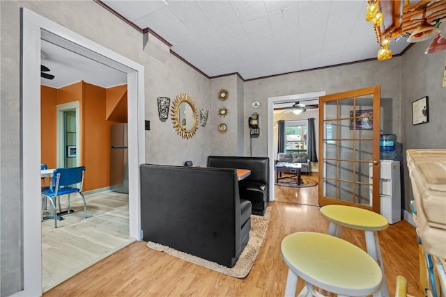 703 N Perry St, Dix, NY 14891 - living area featuring ceiling fan, wood finished floors, and ornamental molding