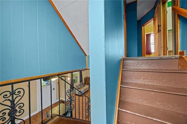 703 N Perry St, Dix, NY 14891 - staircase featuring vaulted ceiling and wood finished floors