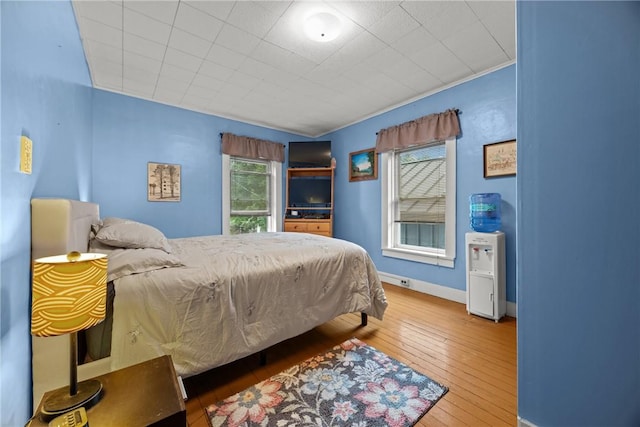 703 N Perry St, Dix, NY 14891 - bedroom with hardwood / wood-style flooring and baseboards